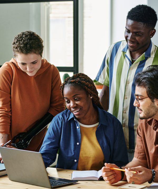 Group of intercultural employees listening to colleague