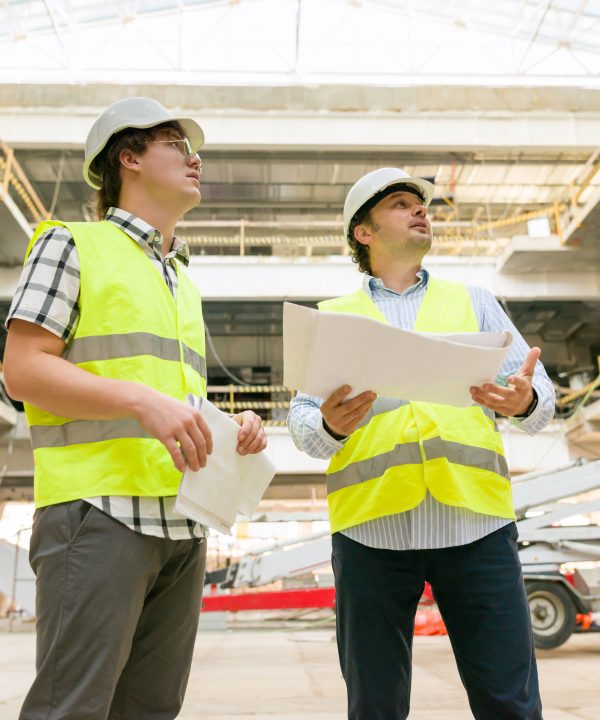 Two business builder people at construction site